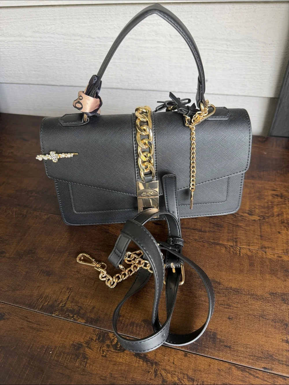 ALDO Black Satchel with Gold Chain and Charm Detail